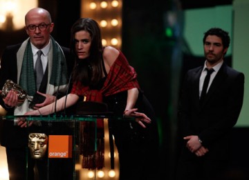 Jacques Audiard, Alix Raynaud and Tahar Rahim accept the award for their film A Prophet, which won the Film Not in the English Language category (BAFTA/Brian Ritchie).