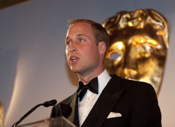 BAFTA's President - watched over by the iconic BAFTA mask - addresses the star-studded crowd.