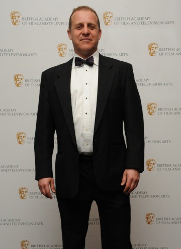 Actor Nigel Lindsay (pictured) announced Jason Savage as the winner, for his work on the Arctic episode of Human Planet. (Pic: BAFTA/Chris Sharp)
