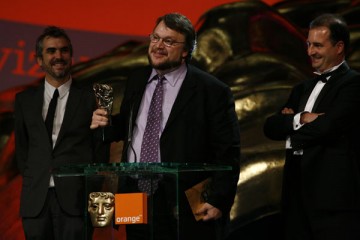 L-r: Alfonso Cuaron, Guillermo del Toro and Alvaro Augustin accept the Film Not in the English Language BAFTA for Pan's Labyrinth (BAFTA / Brian Ritchie).