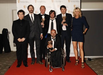 The IT Crowd team with citation readers Micheal McIntyre and Tess Daly celbrate their win in the Situation Comedy category for The IT Crowd (BAFTA/ Richard Kendal).