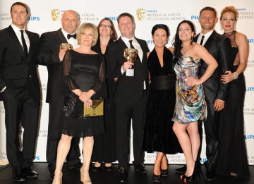 Paddy McGuinness and Cat Deeley presented the production team behind the popular BBC soap EastEnders with the BAFTA for Continuing Drama. (Pic: BAFTA/Richard Kendal)