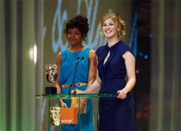Actresses Naomie Harris and Rosamund Pike present the Awards for Production Design and Make-Up & Hair (pic:BAFTA / Camera Press).