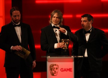 Mark Healey, David Smith and Pete Smith accept the BAFTA for Game Innovation.