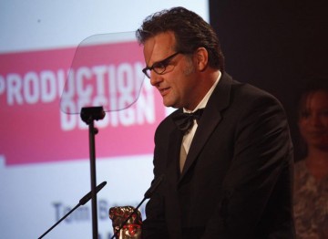 Tom Bowyer accepts the Television Craft Award for Production Design for his work on Misfits. (Pic: BAFTA/Jamie Simonds)