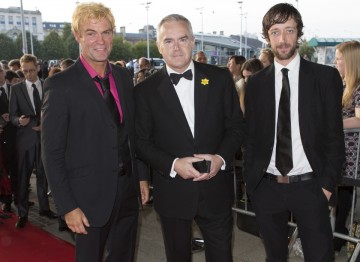 Huw Edwards (centre) arrives at the Awards, nominated in the presenter category