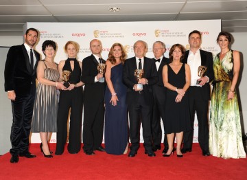 Lord Sugar and the team behind The Young Apprentice celebrate their BAFTA win alongside presenters Suranne Jones and Tom Ellis. 
