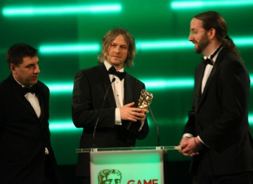 The BAFTA for Best Family Game is picked up by Mark Healey, Savid Smith and Pete Smith.
