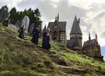 Friendships formed between Harry, Hermione and Ron at Hogwarts. UK locations including Alnwick Castle and Gloucester Cathedral have been used to create the wizard school.