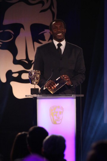 Linford Christie presents the award for Sport at the British Academy Games Awards Ceremony in 2015