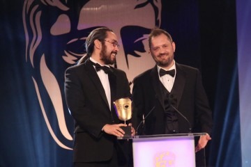 The team behind Never Alone (Kisima Ingitchuna) accept the award for Debut Game at the British Academy Games Awards in 2015