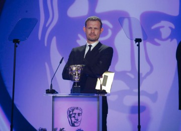 The British Actor, perhaps best known for his role as Nick Tilsley in Coronation Street presents the Visual Effects Award. (Pic: BAFTA/Jamie Simonds)