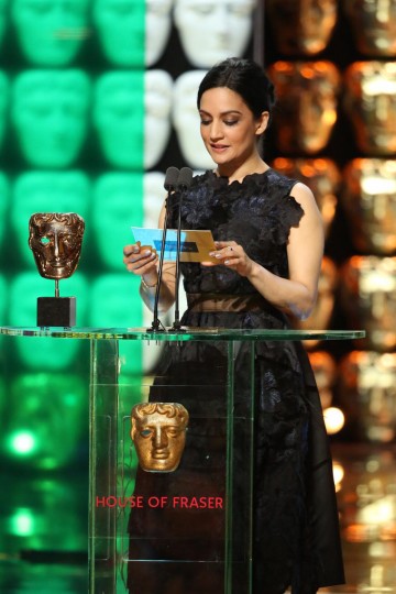Archie Panjabi presents the award for Supporting Actor