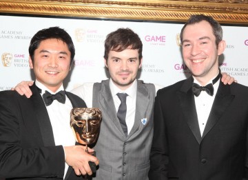 Presenter Barney Harwood with the winners behind the spectacular collection of mini games that triumphed in the Family category. (Pic: BAFTA/Steve Butler)