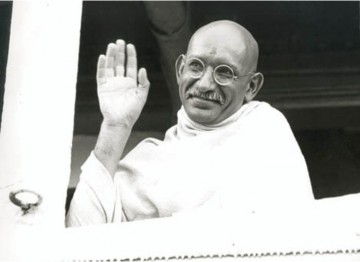 Mahatma Gandhi (Ben Kingsley) waves farewell as the steamship taking him to London gets underway in Bombay.