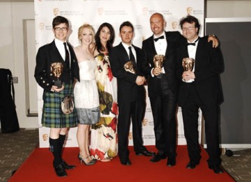 Jamie Isaacs, Gareth Malone, Henry Beney and Rob McCabe celebrate their win in the Features category for The Choir: Boys Don't Sing (BAFTA/ Richard Kendal).