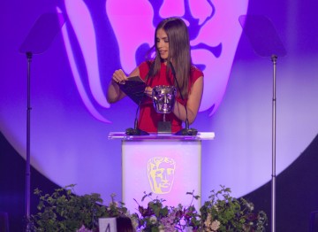Actress Charlotte Riley presents the BAFTA for Costume Design.