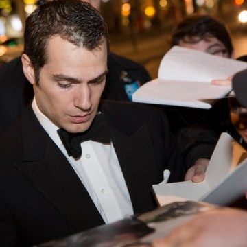 Henry Cavill signs autographs for fans outside BAFTA 195