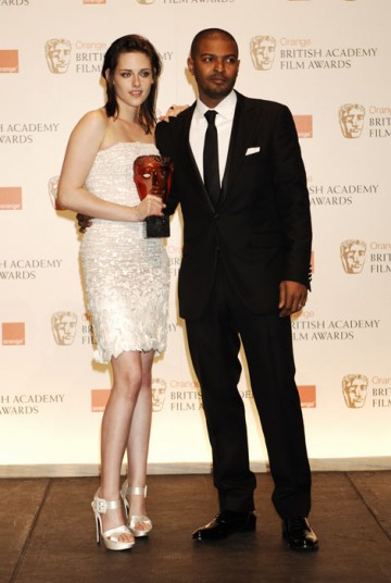 Kristen Stewart celebrates winning the Orange Rising Star Award with the winner in 2009, Noel Clarke (BAFTA/Richard Kendal).