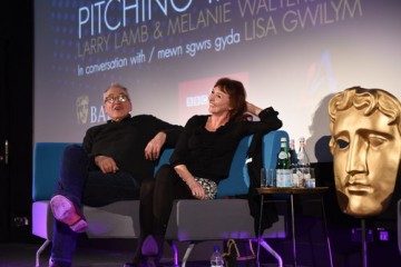 Melanie Walters and Larry Lamb Pitching In