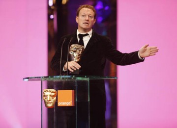 And the BAFTA goes to... Slumdog Millionaire makes it five BAFTAs for the first nine categories as Simon Beaufoy collected the Adapted Screenplay Award (BAFTA / Marc Hoberman).