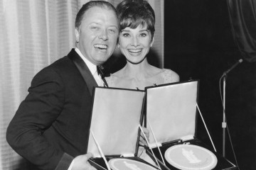 Richard Attenborough & Audrey Hepburn display their Actor and Actress awards at the British Film Academy Awards in 1965.