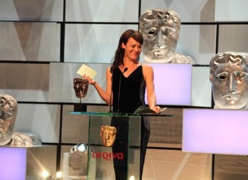 Helen McCrory presents the award for Supporting Actor.