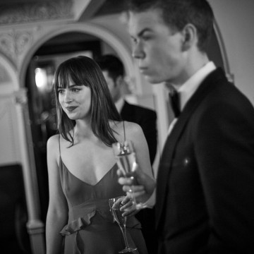 Presenters of the Outstanding Debut Award Dakota Johnson and Will Poulter relax backstage at London's Royal Opera House
