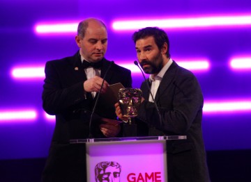 Comedian and DJ Adam Buxton and Philip Oliver (co-founder of Blitz Games Studios) present the BAFTA for Family. 