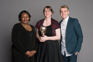 Debbie Moon, winner of the Writer category for Wolfblood at the British Academy Children's Awards in 2014, presented by Children's Laureate Malorie Blackman OBE, with the show's star Bobby Lockwood