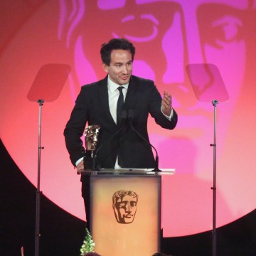 Marcel Mettelseifen accepts the award for Photography: Factual at the British Academy Television Craft Awards in 2015