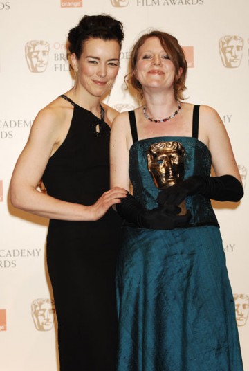 Emma Lazenby poses with Olivia Williams after collecting the Short Animation Award for Mother of Many on behalf of co-nominee Sally Arthur (BAFTA/Richard Kendal).