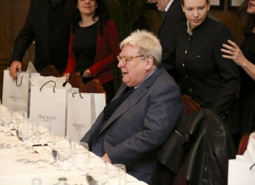 Sir Alan Parker takes his seat at the table.