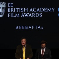Stephen Fry and Sam Claflin take to the podium to reveal the nominations for the EE British Academy Film Awards in 2015.