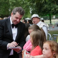 Downton Abbey star Brendan Coyle signs autographs for some young fans.