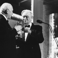 Sir Alec Guinness accepts the BAFTA Fellowship from Sir David Lean in 1989.