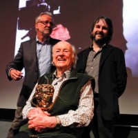 Tony Dalton, Ray Harryhausen with his award, and  Peter Jackson on stage after the event (BAFTA/Brian J Ritchie).