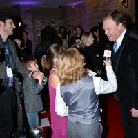 Presenter nominee Justin Fletcher is interviewed by children on the red carpet of the British Academy Children's Awards in 2014