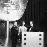 Richard Attenborough on stage with Diana Rigg and Eamonn Andrews at the British Academy Film Awards in 1976.