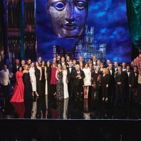 Downton Abbey cast and crew on stage accepting the Special Award at the BAFTA Downton Abbey Tribute event.
