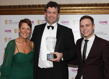David Tyler is joined by Olly Murs and Game's Lisa Morgan after the British public voted Call of Duty: Modern Warfare 2 their favourite title of the last year in the Game Award 2009 (BAFTA/Steve Butler).