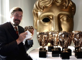 Stephen Fry with BAFTA masks