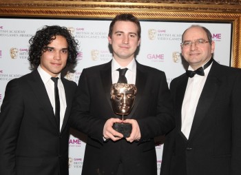 Presenters Reece Ritchie and Andrew Oliver with the Gameplay winner. SMG2 was praised by the jury for its smooth and simple controls and excellent open structure. (Pic: BAFTA/Steve Butler)