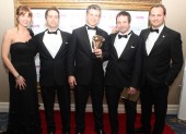Gaëlec Simard with team, plus presenters Gemma Atkinson and Ben ‘The Stig’ Collins, with their BAFTA for exhilarating action adventure Assassin’s Creed Brotherhood. (Pic: BAFTA/Steve Butler)