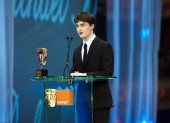 Harry Potter star Daniel Radcliffe on stage to present the Award for Outstanding British Contribution to Cinema (pic:BAFTA / Camera Press).