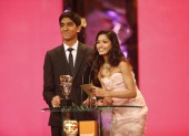 Slumdog stars Dev Patel and Freida Pinto teamed up again to present the BAFTA for Costume Design (BAFTA / Marc Hoberman).