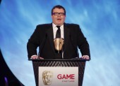 Labour Politician and video games enthusiast Tom Watson announces the winning game in the Multiplayer category (BAFTA/Brian Ritchie)