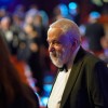 BAFTA Fellow Mike Leigh arrives in the Royal Opera House Auditorium.