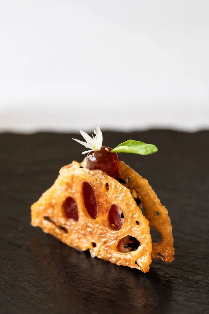 A delicate canape of crispy vegetables with a puree and gel filling.