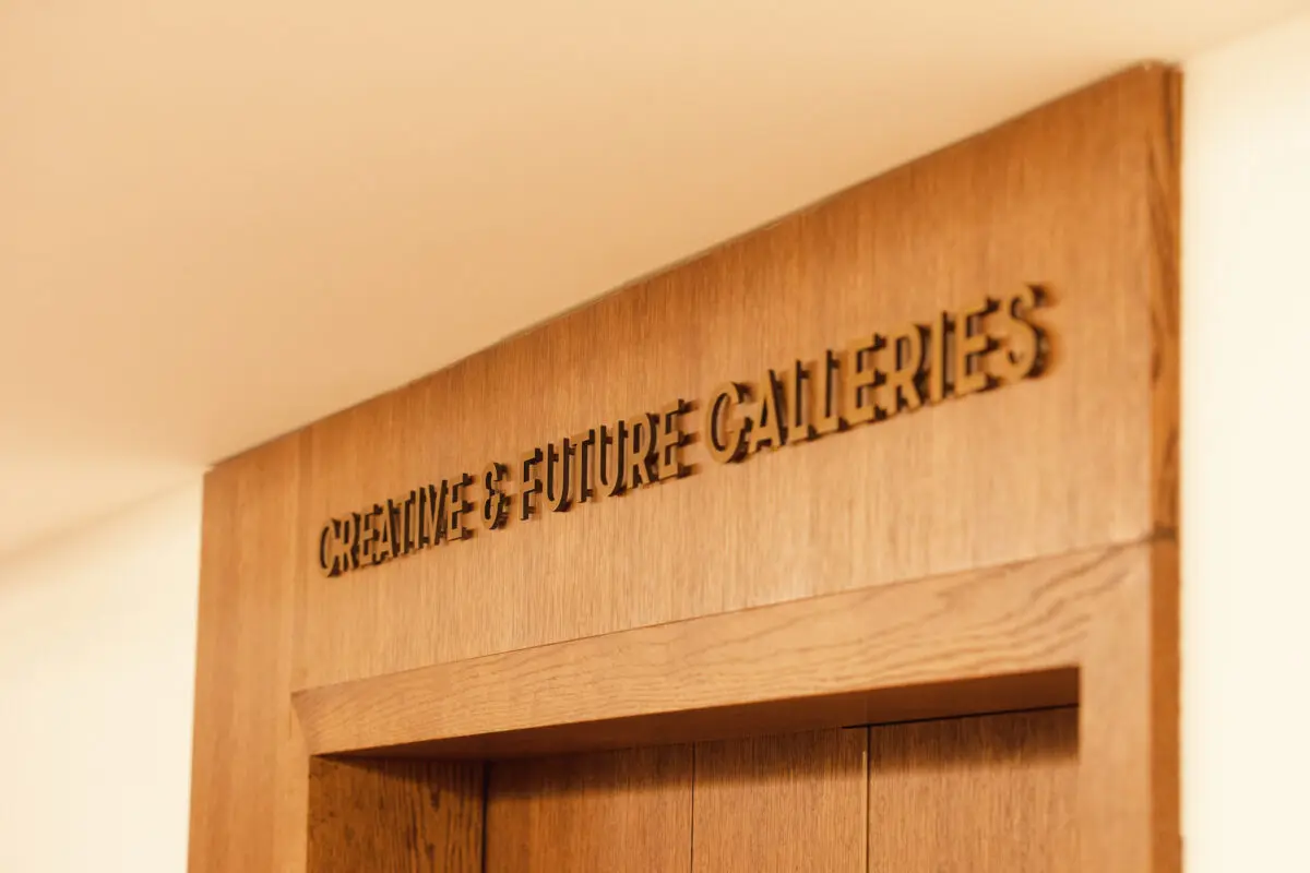 The Creative and Futures Gallery sign above a wooden door.